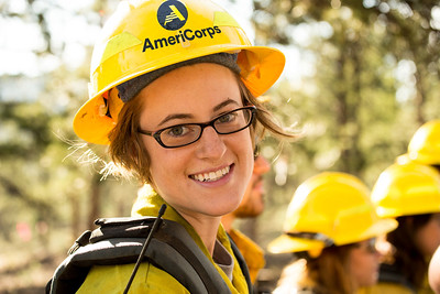 woman wearing AmeriCorps hard hat